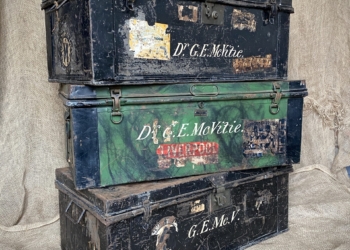 A trio of late 19th/early 20th century metal strong box travel trunks by Griffiths, McAlister Ltd.